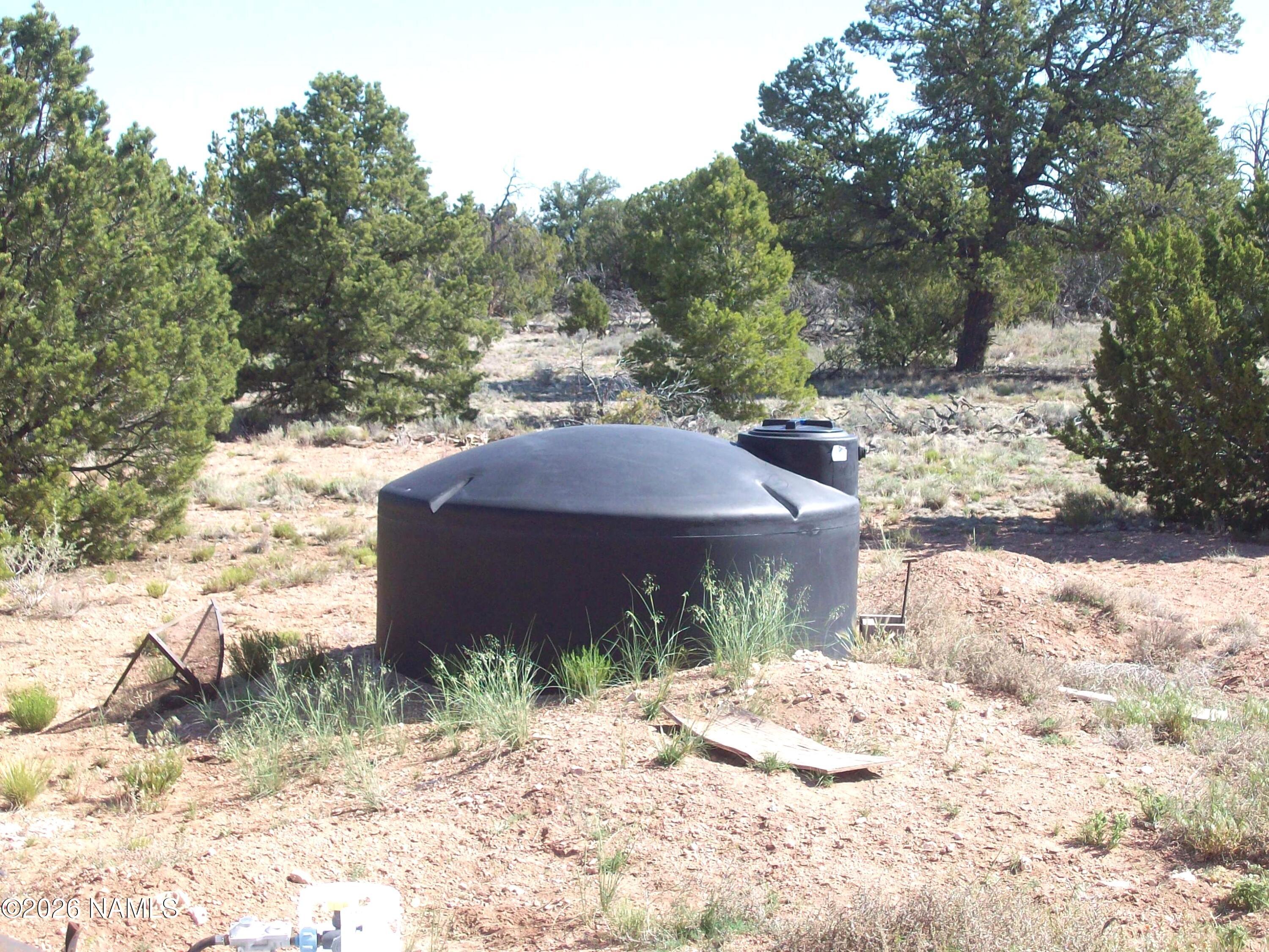 4063 East Woodland Ranch Road Williams, AZ 86046 - Photo 9 of 33 a front view of a house with a yard