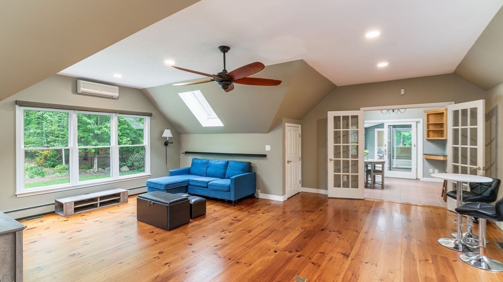 142 Baker Street Walpole, MA 02081 - Photo 16 of 42 a living room with furniture and large windows