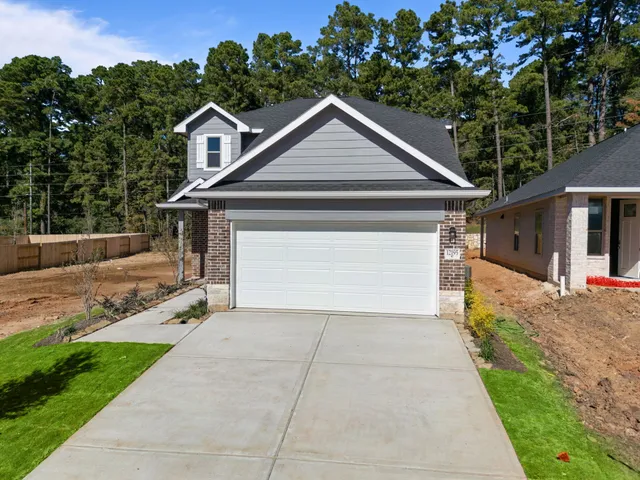 a front view of a house with yard