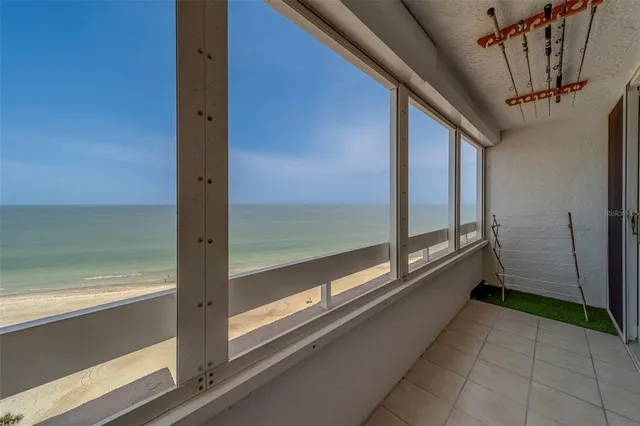 a view of a balcony with chairs