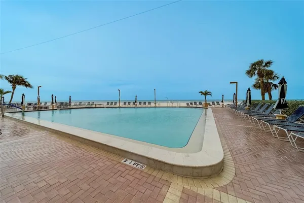 a view of outdoor space with swimming pool and furniture