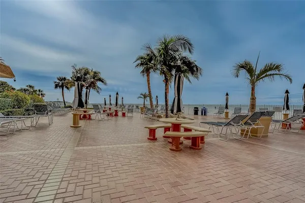 a view of a swimming pool with a patio