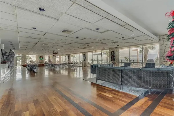 a view of a room with furniture and window