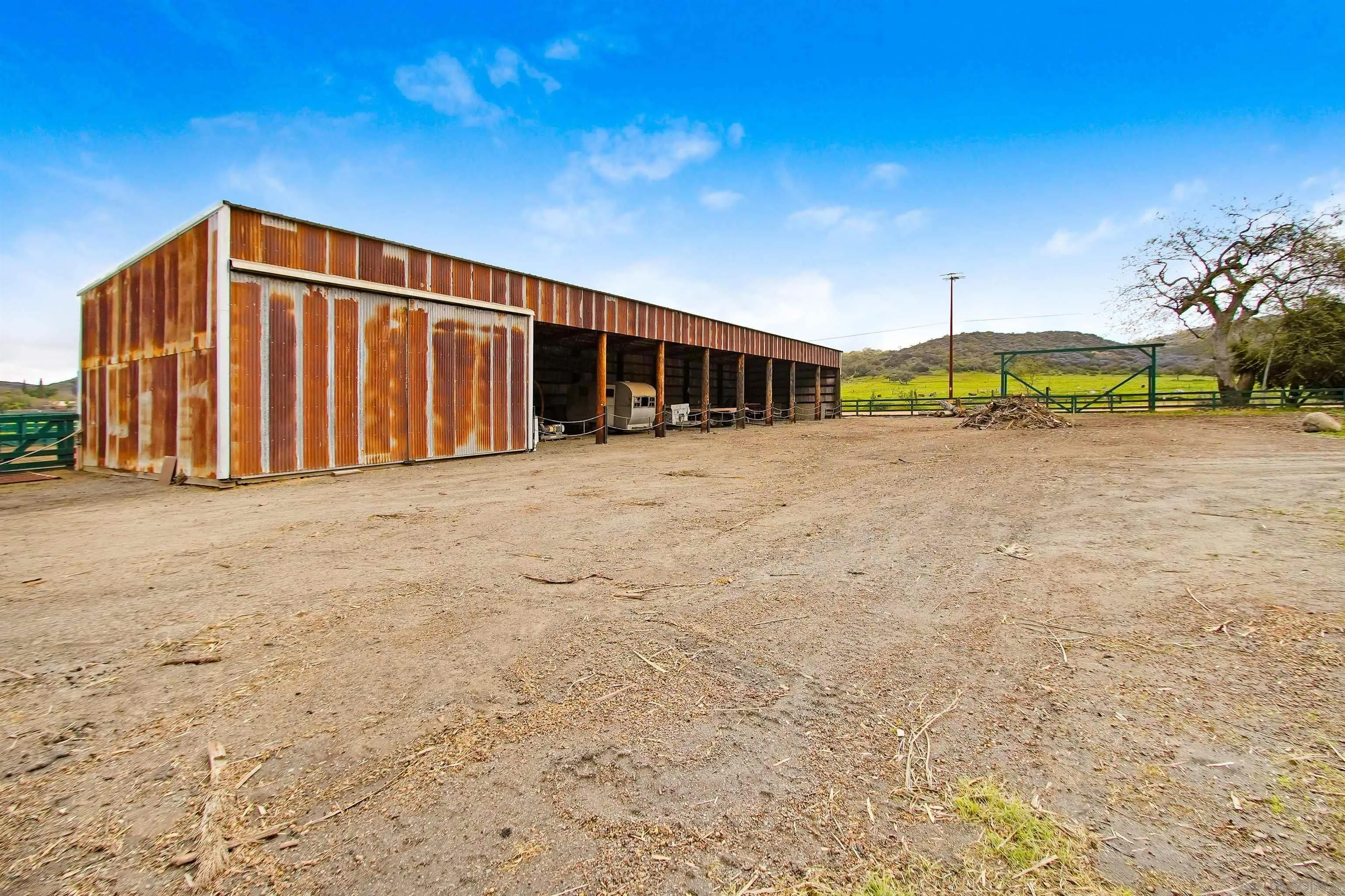 16757 Old Guejito Grade Road Escondido, CA 92027 - Photo 27 of 49 a big room with yard and car parked in front of it