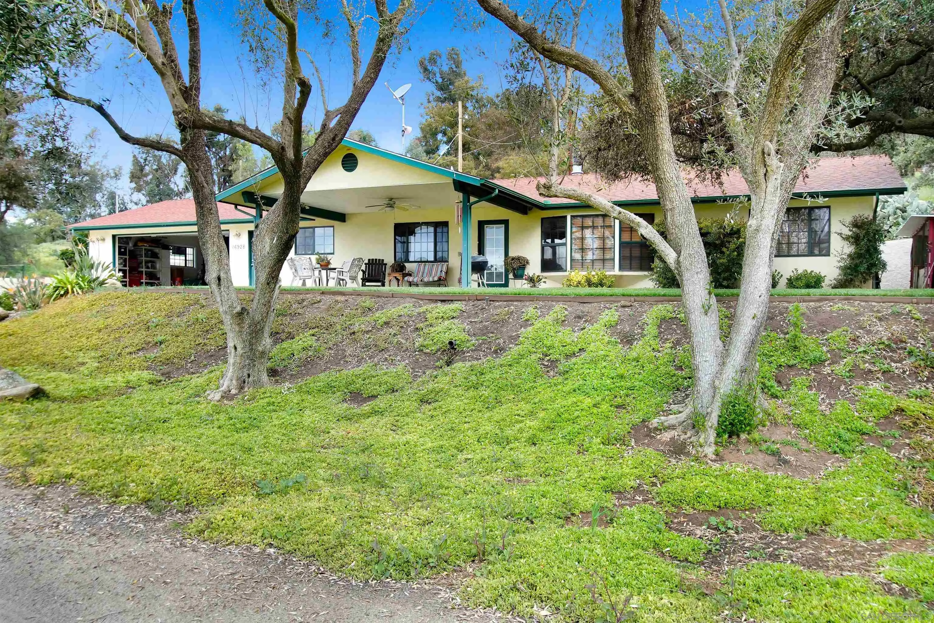 16757 Old Guejito Grade Road Escondido, CA 92027 - Photo 33 of 49 a front view of a house with garden