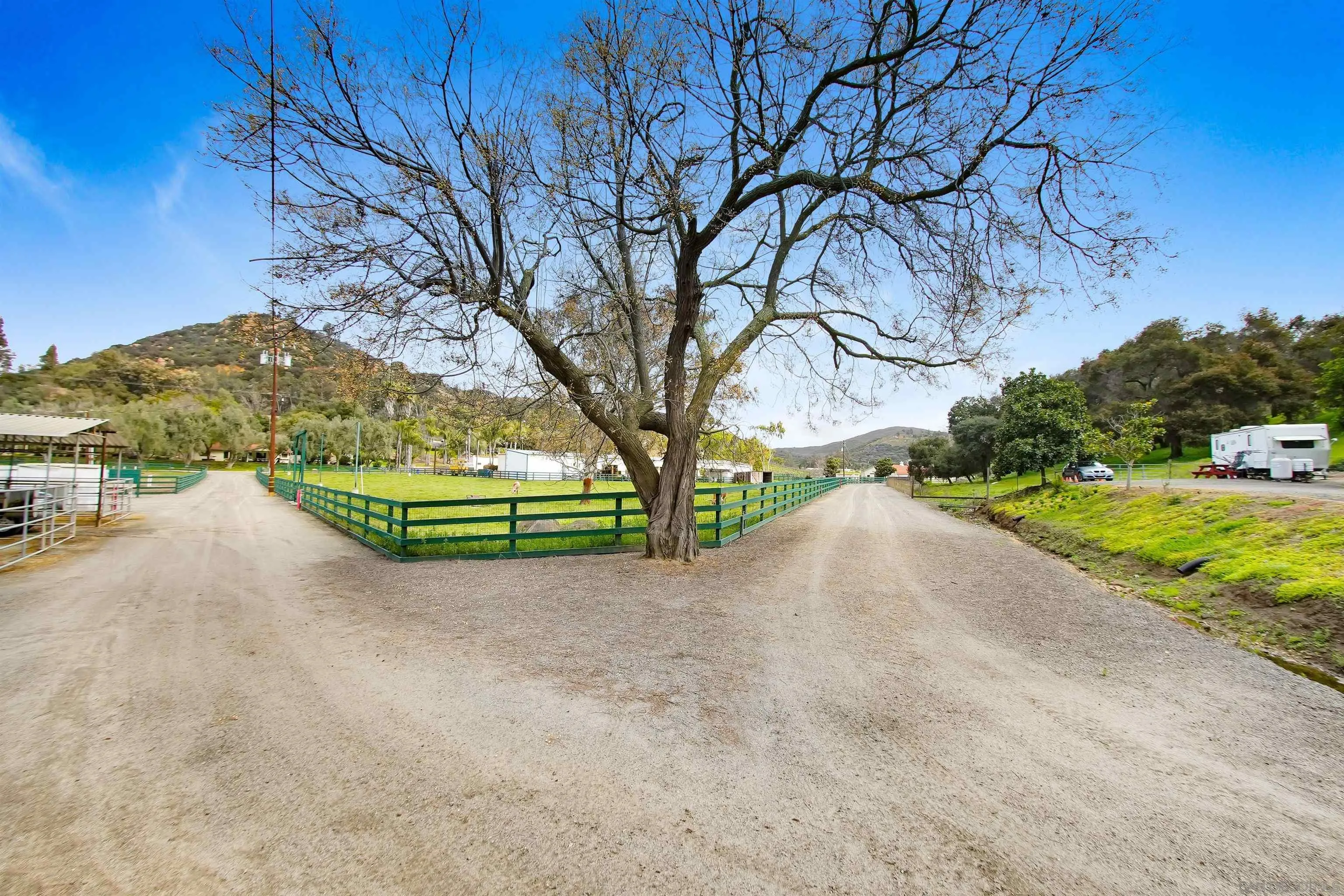 16757 Old Guejito Grade Road Escondido, CA 92027 - Photo 35 of 49 a view of a street with a tree in the background