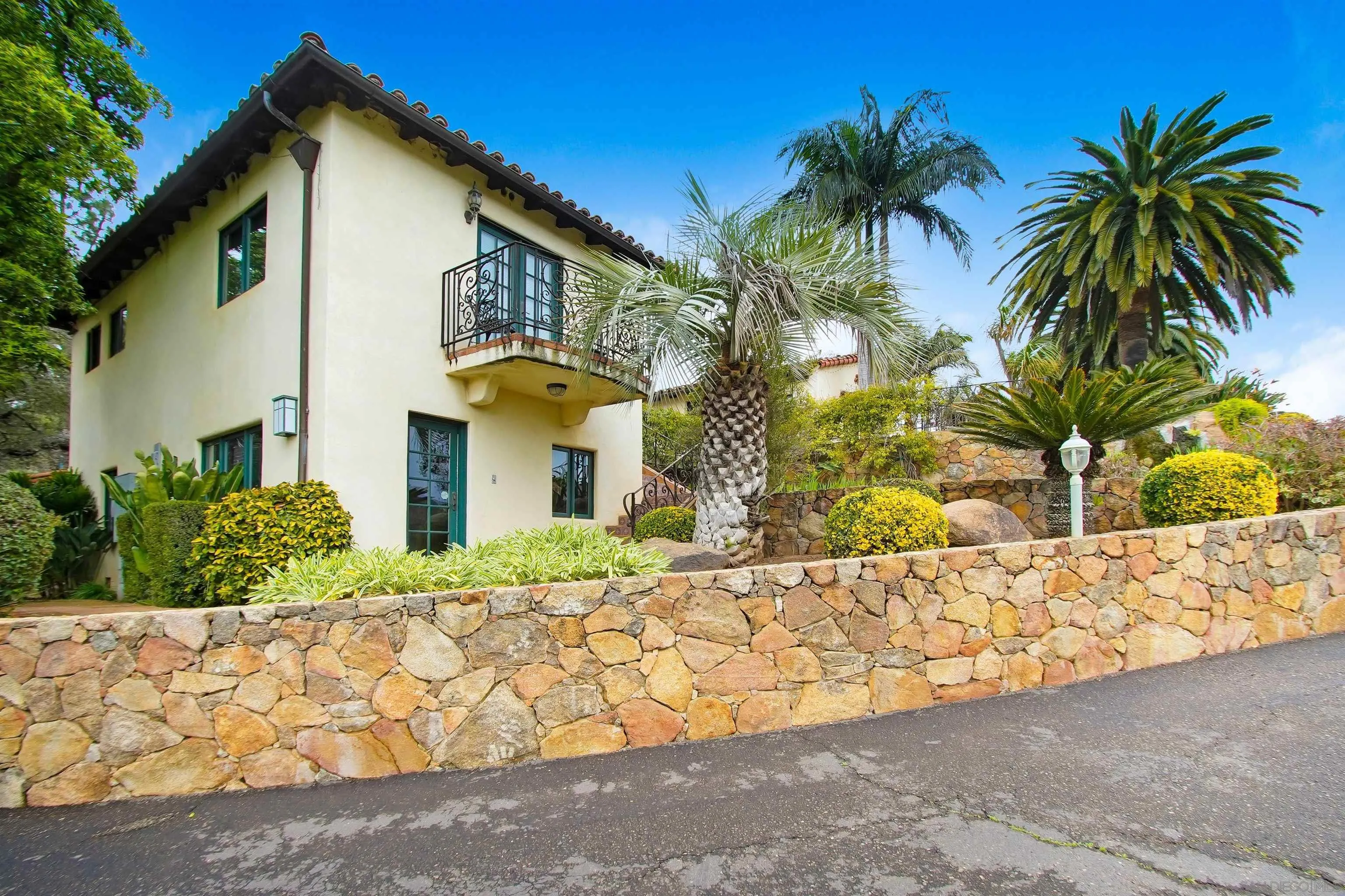 16757 Old Guejito Grade Road Escondido, CA 92027 - Photo 5 of 49 a front view of a house with a yard and garage