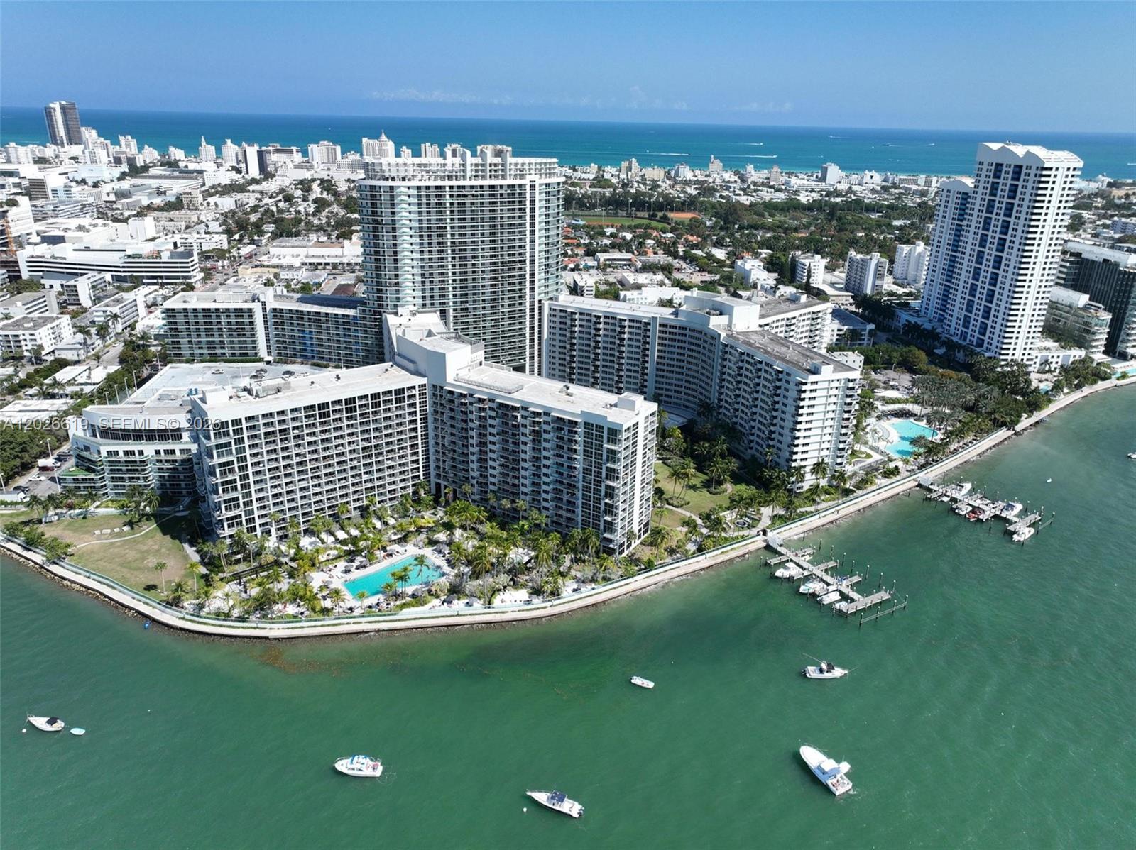 1500 Bay Road, Unit 1268S Miami Beach, FL 33139 - Photo 28 of 31 a view of roof deck with a swimming pool and outdoor seating