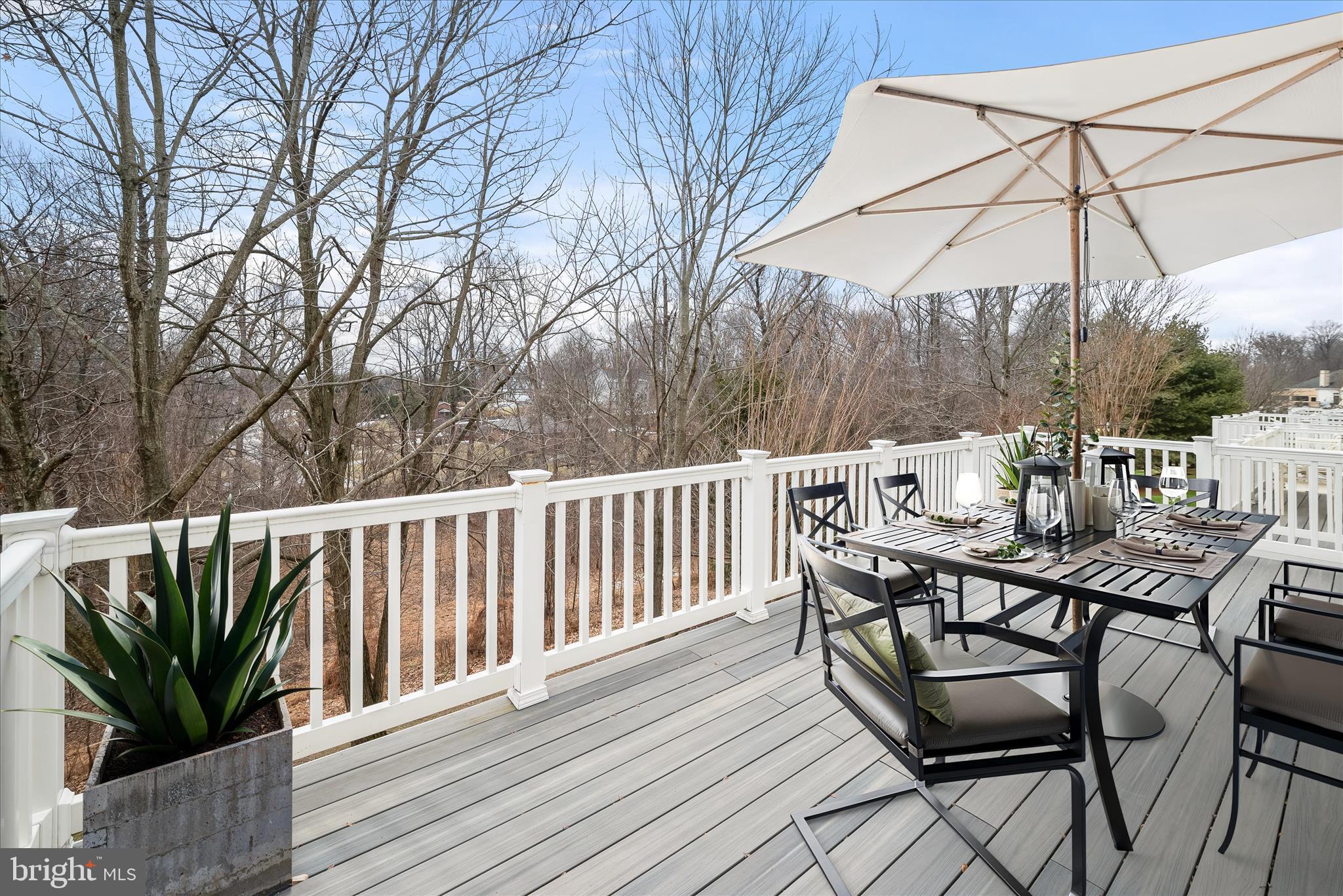8736 Endless Ocean Way, Unit 24 Columbia, MD 21045 - Photo 17 of 61 a view of a chairs and table on the deck