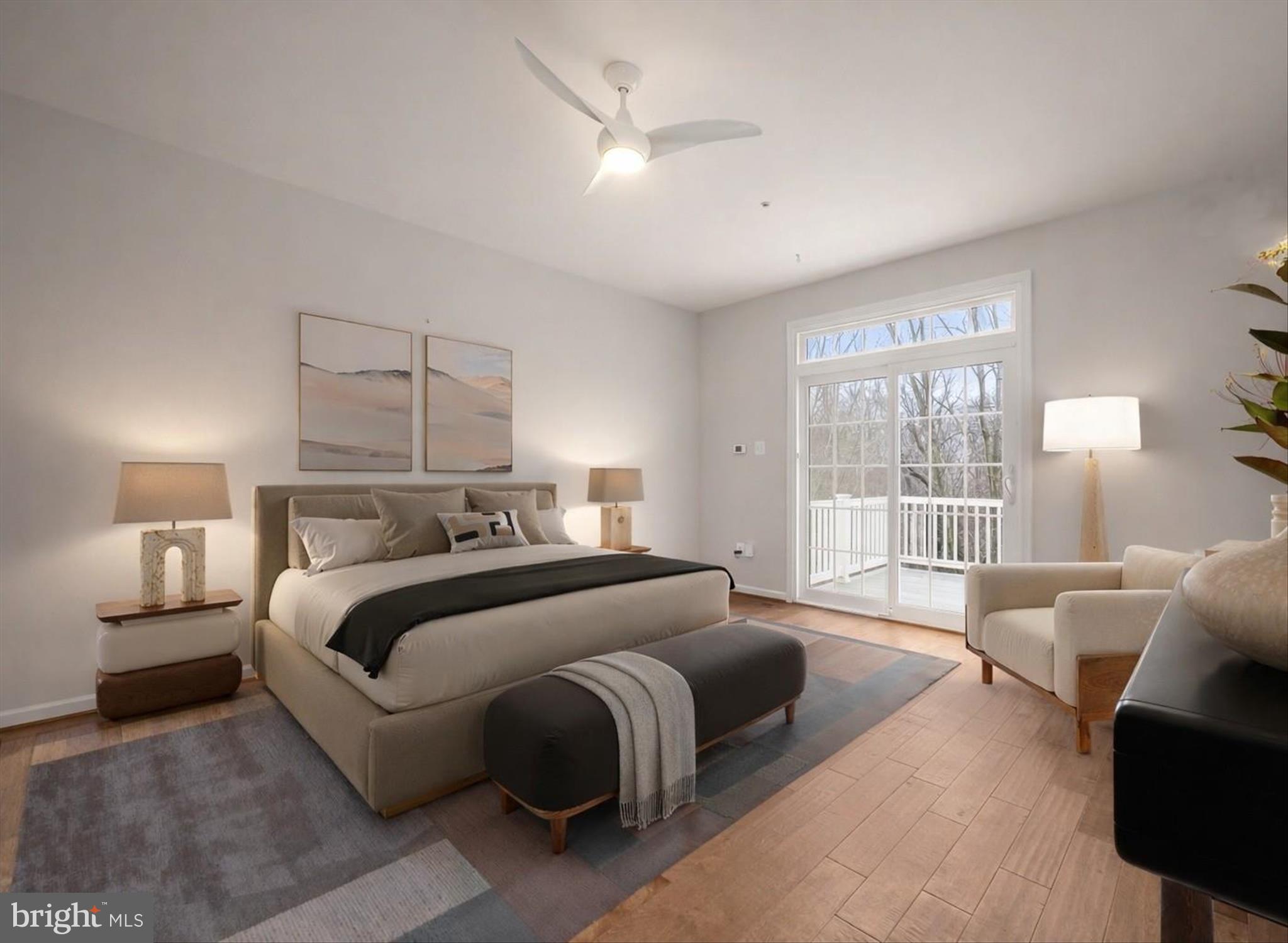 8736 Endless Ocean Way, Unit 24 Columbia, MD 21045 - Photo 20 of 61 a bedroom with a large bed couch and a large window