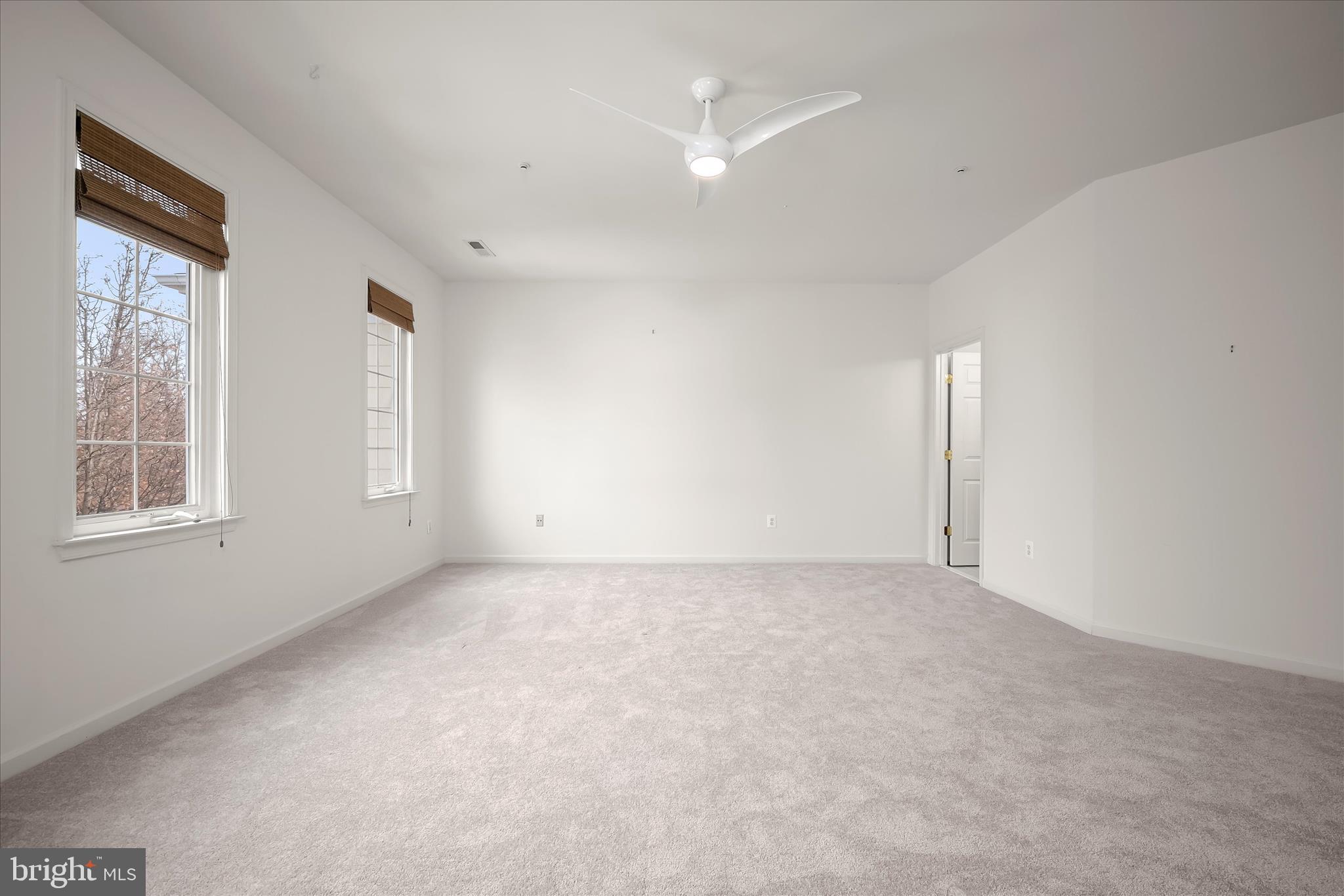 8736 Endless Ocean Way, Unit 24 Columbia, MD 21045 - Photo 33 of 61 a view of an empty room with a window