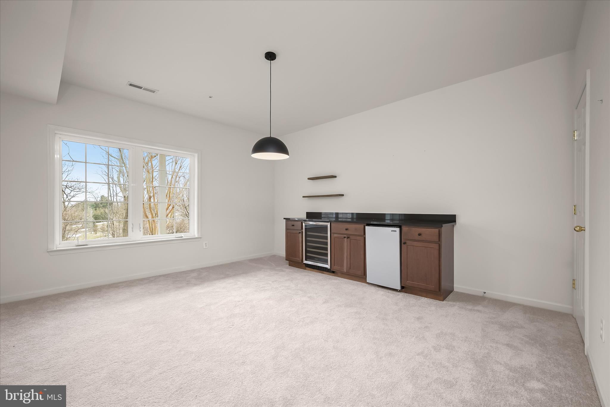 8736 Endless Ocean Way, Unit 24 Columbia, MD 21045 - Photo 44 of 61 a view of an empty room with a window