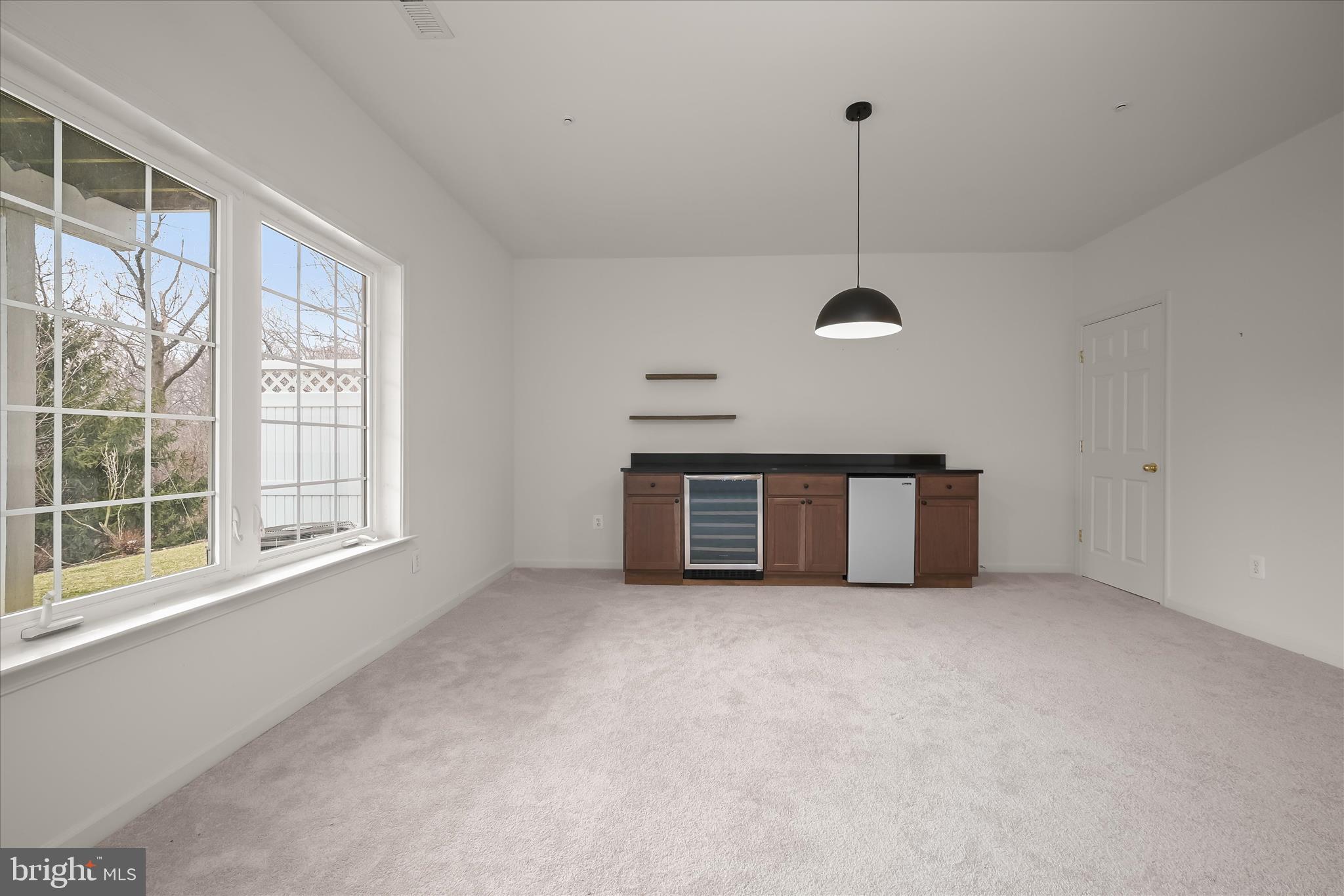 8736 Endless Ocean Way, Unit 24 Columbia, MD 21045 - Photo 46 of 61 a view of an empty room with a window