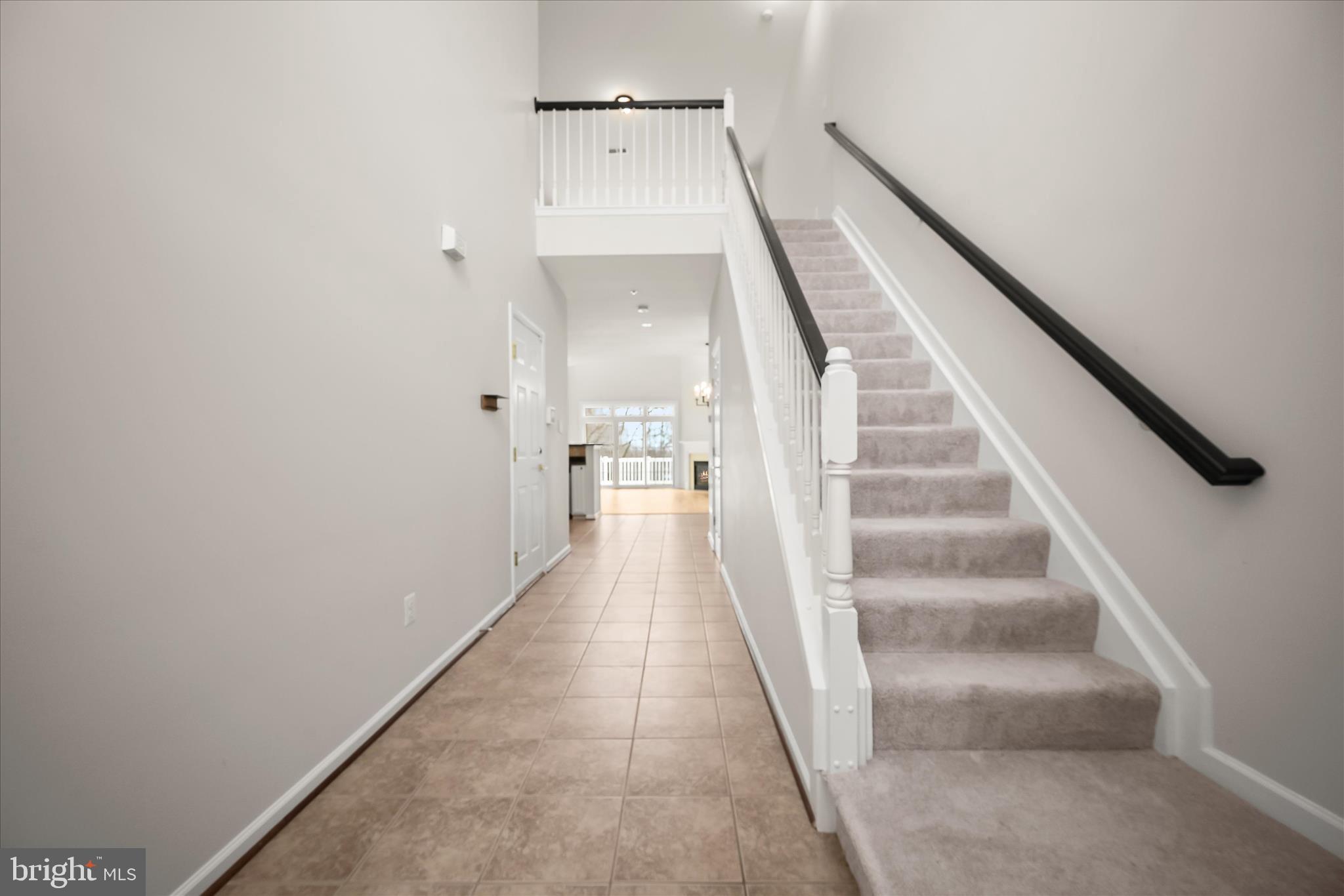 8736 Endless Ocean Way, Unit 24 Columbia, MD 21045 - Photo 5 of 61 a view of staircase with white walls