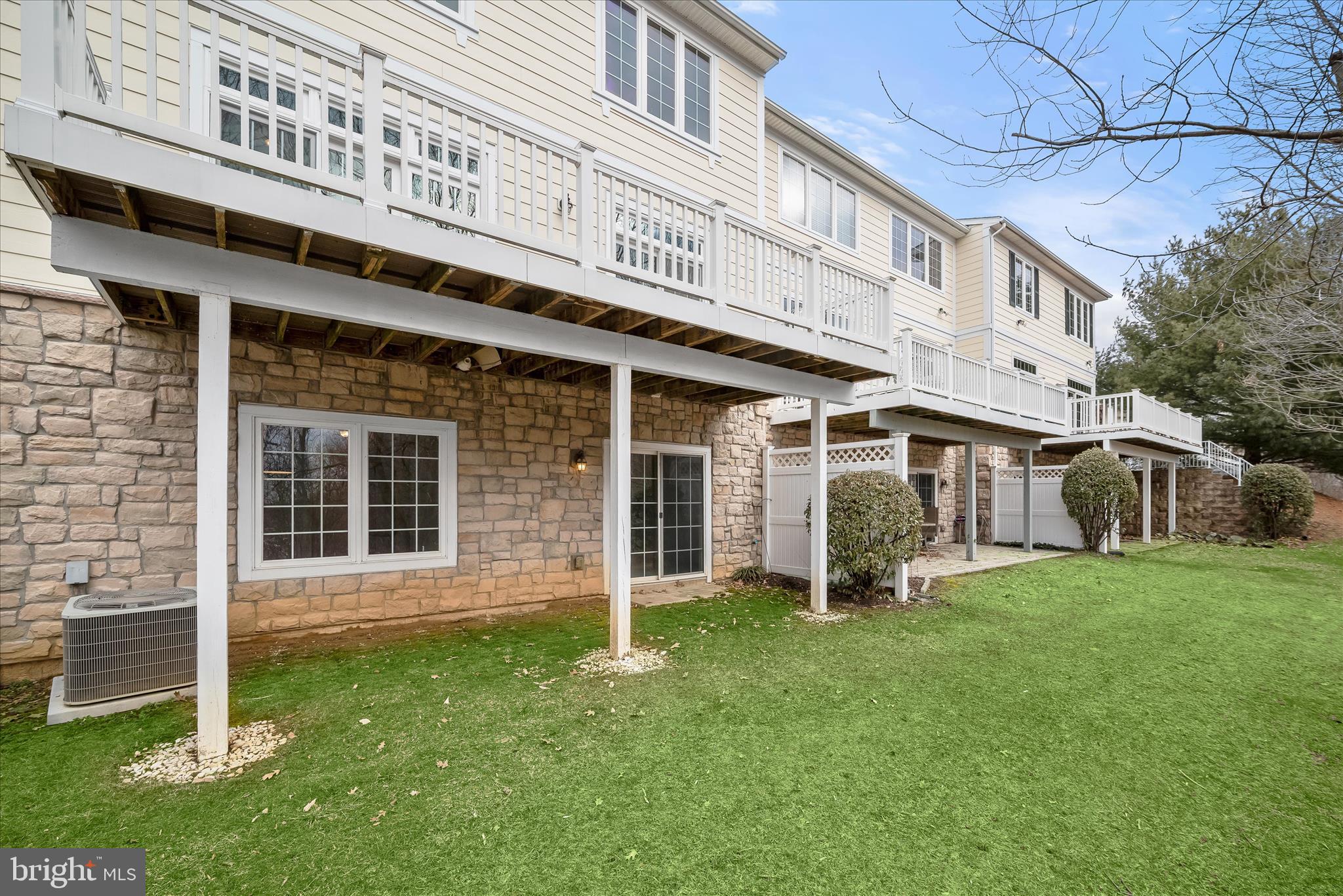8736 Endless Ocean Way, Unit 24 Columbia, MD 21045 - Photo 54 of 61 a front view of a building with a garden