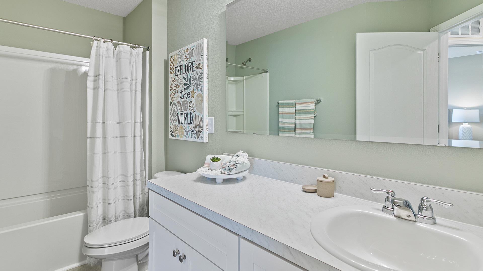 235 Redbud Road Palm Coast, FL 32137 - Photo 25 of 39 a bathroom with a sink a toilet and shower