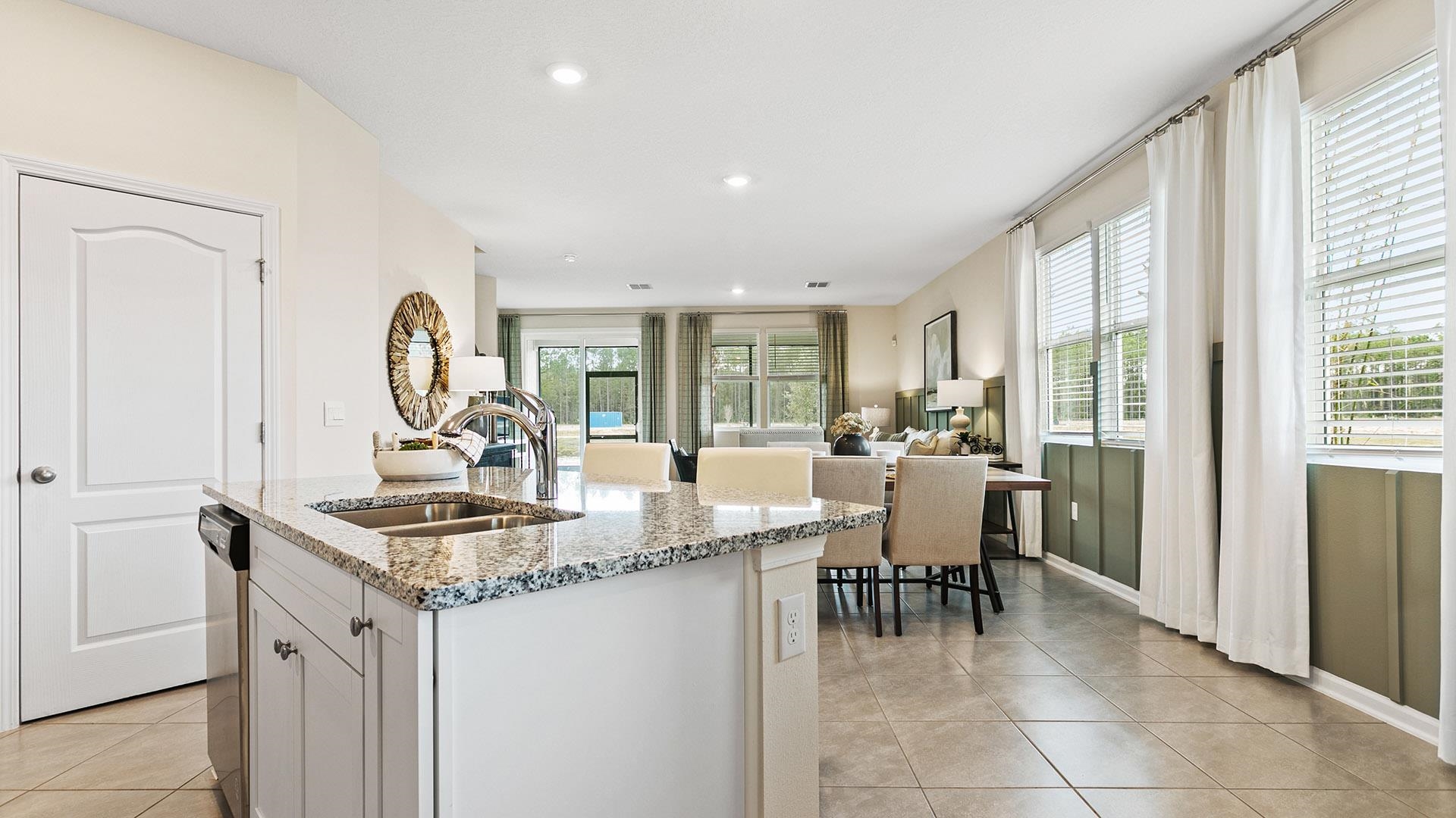 235 Redbud Road Palm Coast, FL 32137 - Photo 7 of 39 a dining hall with stainless steel appliances granite countertop a granite counter tops and a view of living room