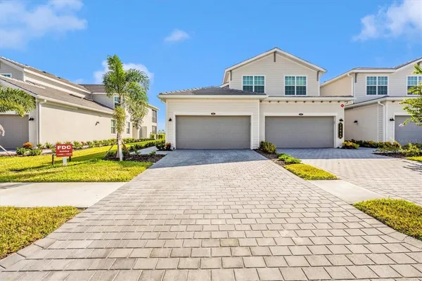 a view of a house with swimming pool and a yard