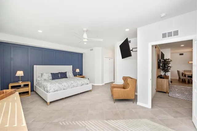 a spacious bathroom with a double vanity sink mirror and toilet