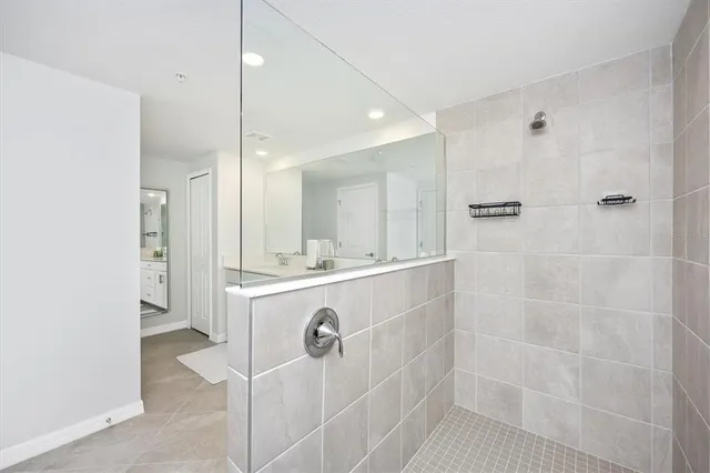 a living room with furniture and floor to ceiling window