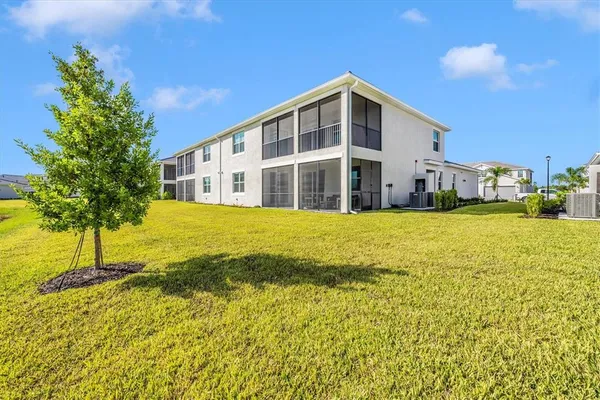a view of a room with gym equipment and a large window