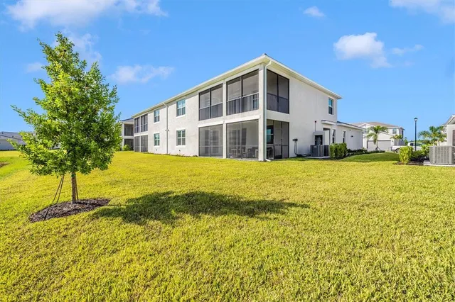 a view of a room with gym equipment and a large window