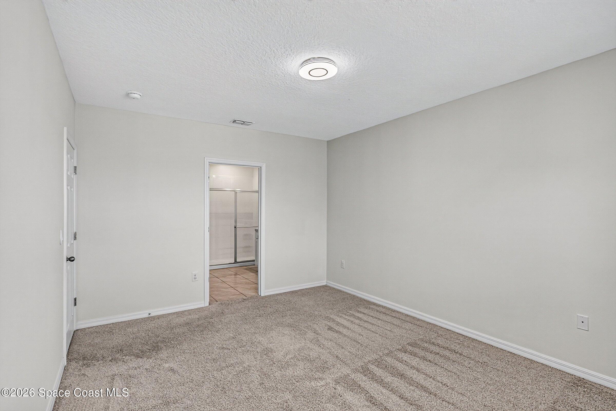3419 Foggy Mist Road Southeast Palm Bay, FL 32909 - Photo 8 of 39 Primary Bedroom