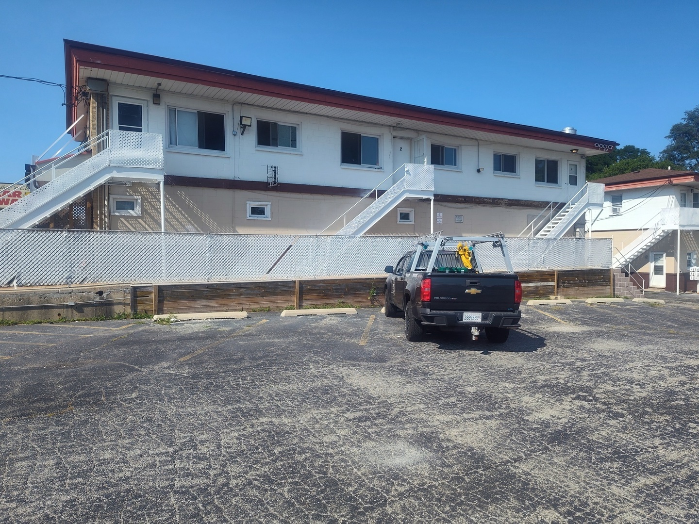 1039 Sheridan Road, Unit 3 Winthrop Harbor, IL 60096 - Photo 1 of 9 a big house with a large tree in front of it