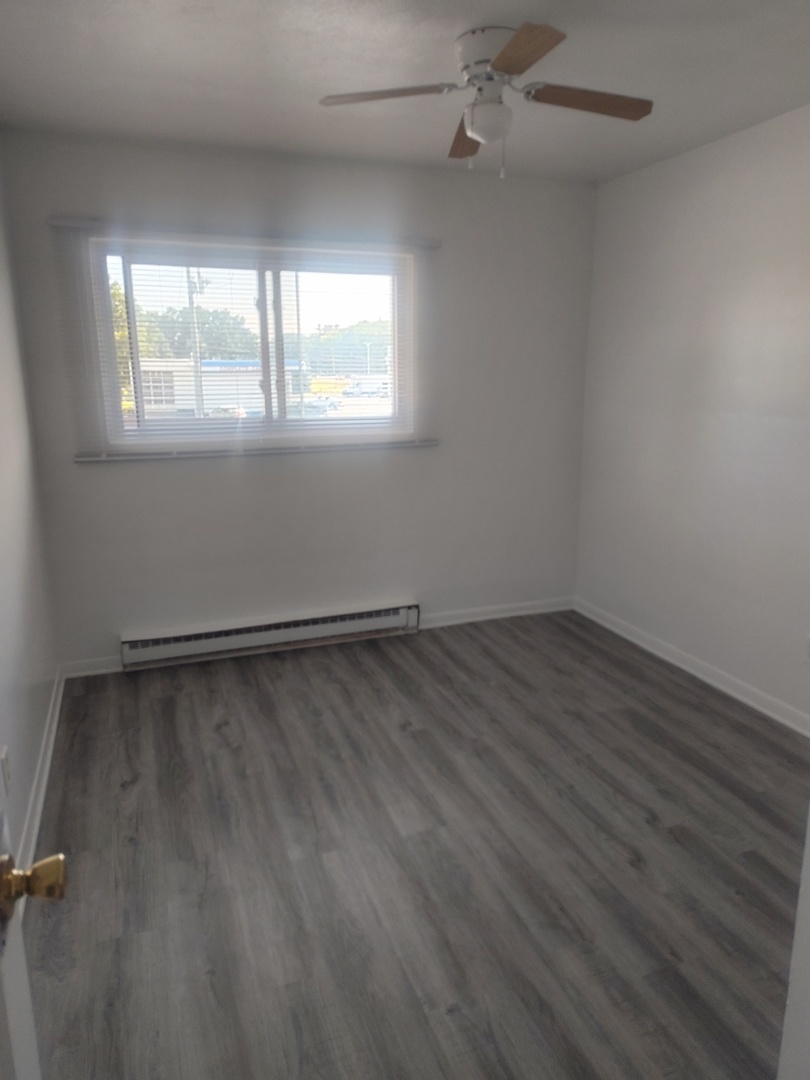 1039 Sheridan Road, Unit 3 Winthrop Harbor, IL 60096 - Photo 7 of 9 an empty room with a window