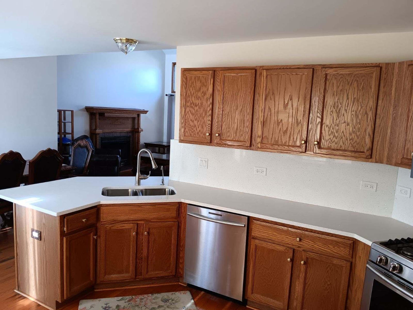 1560 Mallards Cove Beecher, IL 60401 - Photo 12 of 43 a kitchen with a sink cabinets and a stove top oven