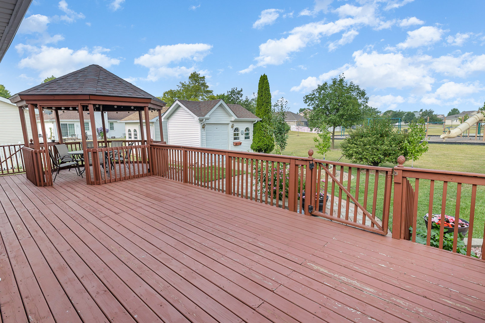 1560 Mallards Cove Beecher, IL 60401 - Photo 30 of 43 a view of a house with wooden deck