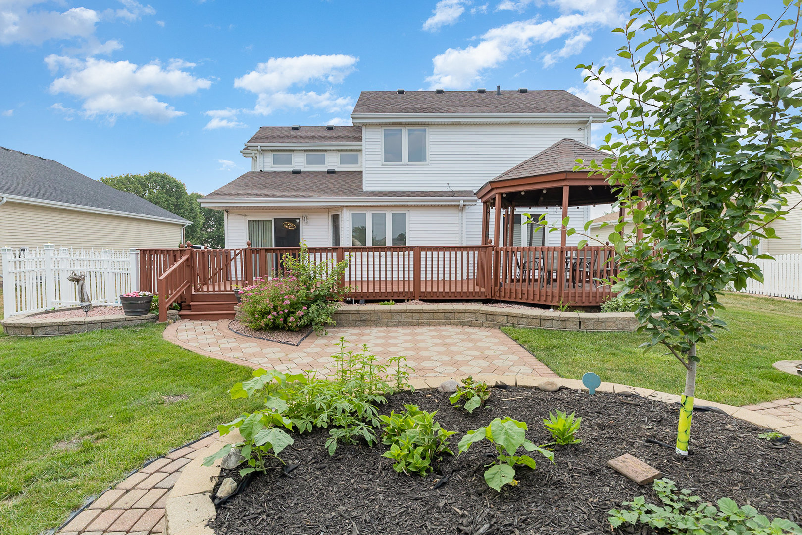 1560 Mallards Cove Beecher, IL 60401 - Photo 32 of 43 a front view of a house with a garden