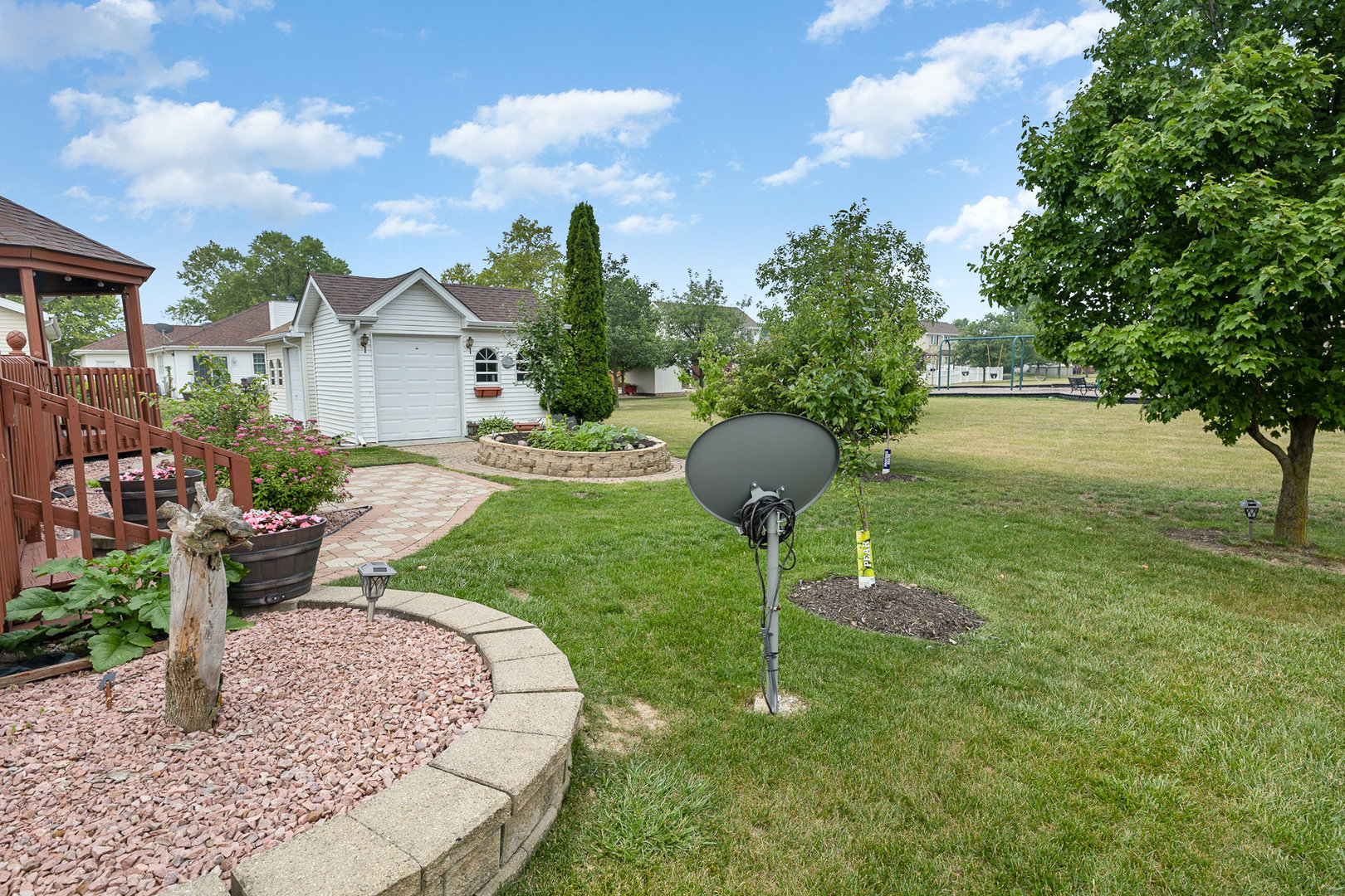 1560 Mallards Cove Beecher, IL 60401 - Photo 40 of 43 a view of a fire pit in front of a house