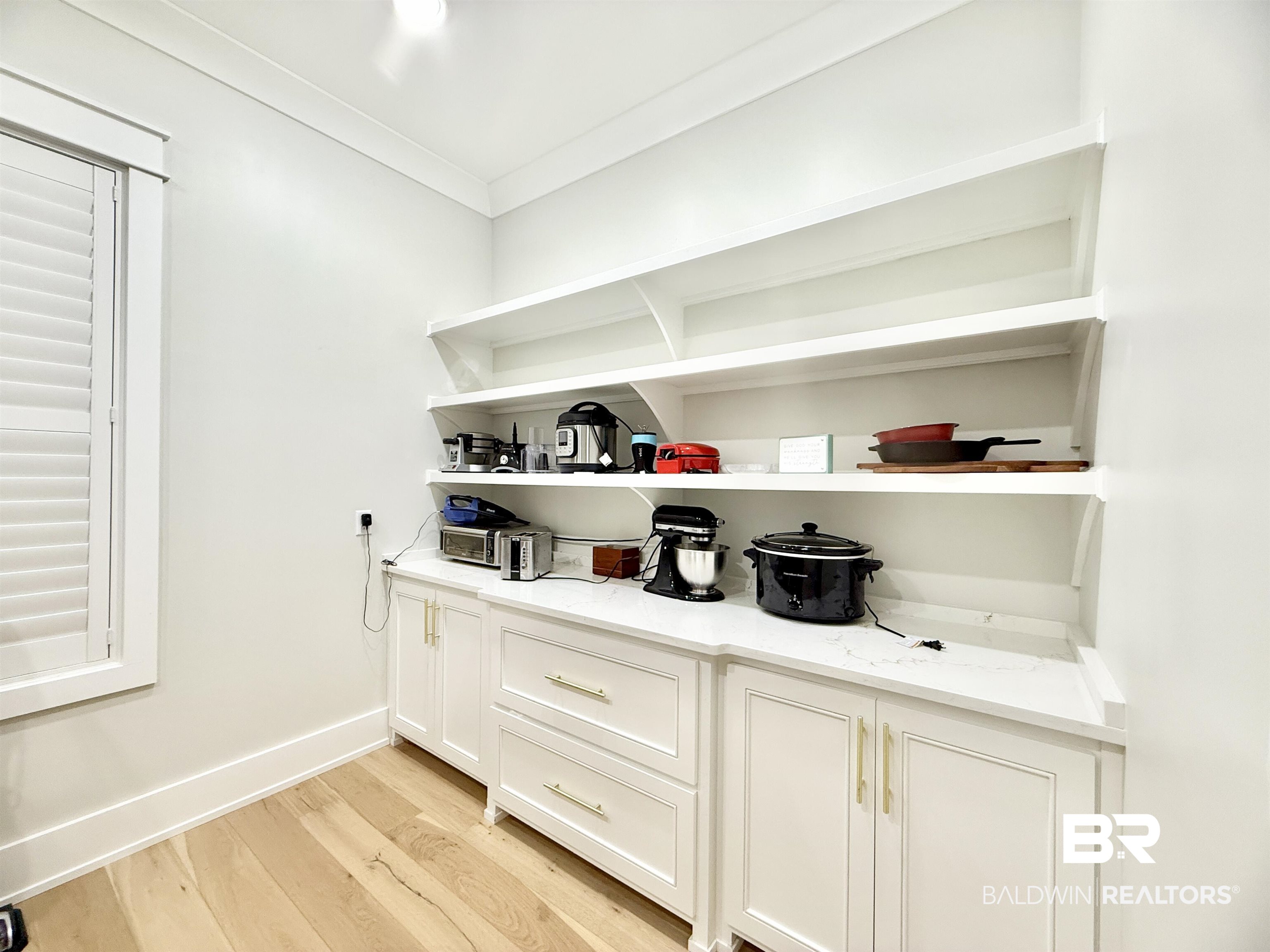21767 Gallery Boulevard Fairhope, AL 36532 - Photo 17 of 74 Bar with light wood finished floors and baseboards