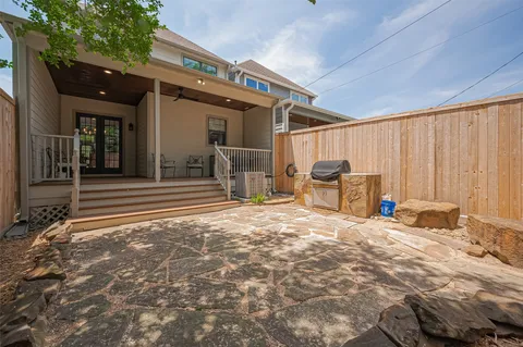 a view of a patio with chair and tables