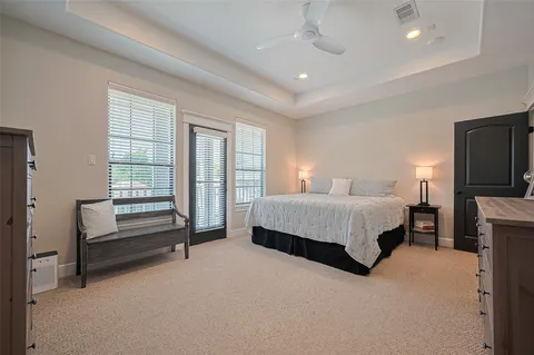 a bedroom with a bed and a television