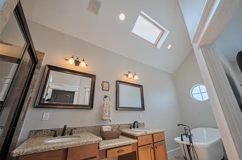 a bathroom with 2 sink and a mirror