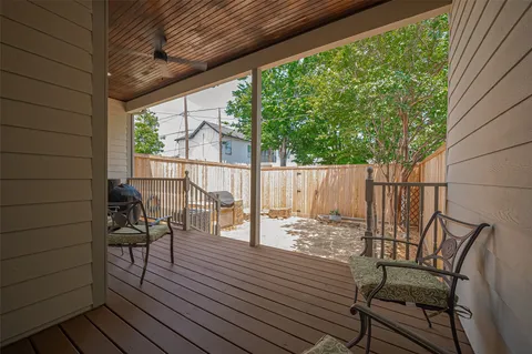 a view of a chairs and table on the wooden deck