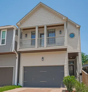 a front view of a house with garage