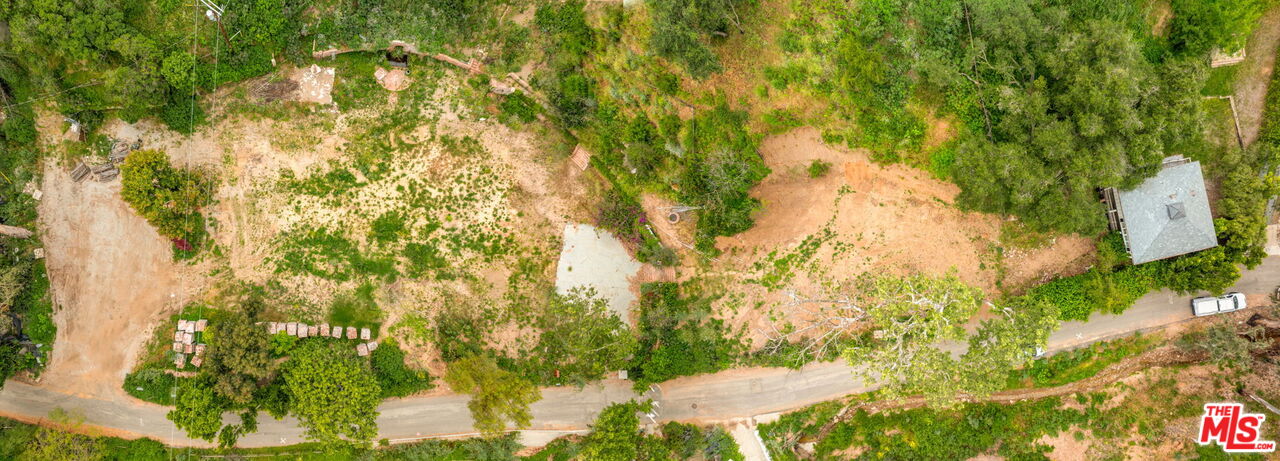 1001 Rivas Canyon Road Pacific Palisades, CA 90272 - Photo 3 of 9 a backyard of a house with lots of green space