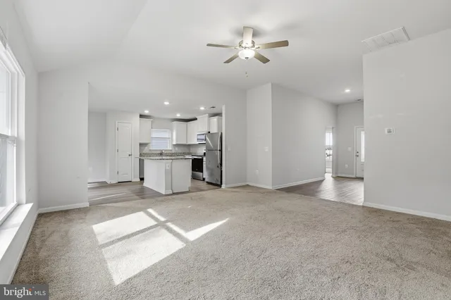 a view of a kitchen with a sink and a window