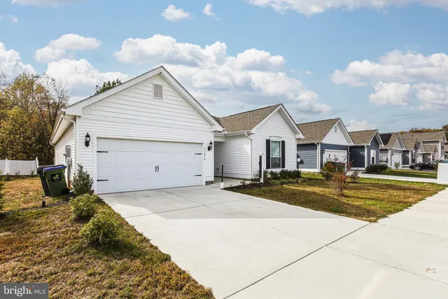 a view of a house with basketball court