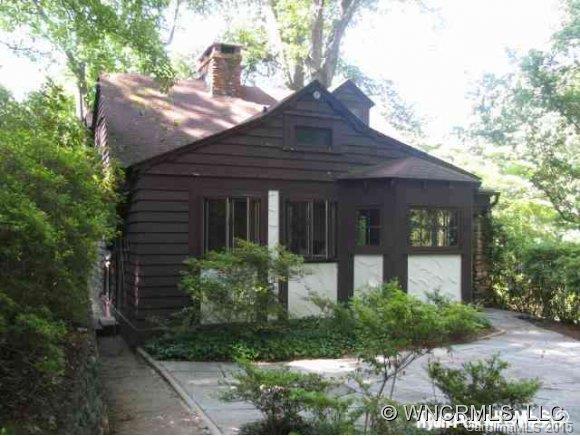 274 Baker Road Tryon, NC 28782 - Photo 1 of 1 a front view of a house with garden