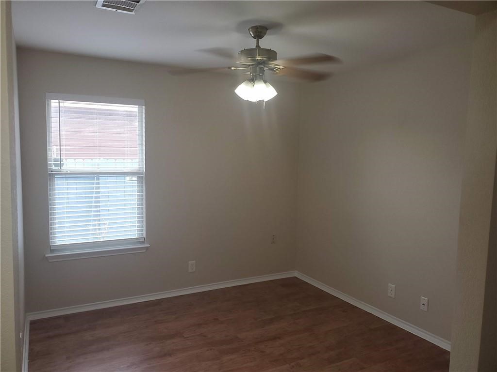 551 New Country Road Kyle, TX 78640 - Photo 12 of 34 an empty room with a window
