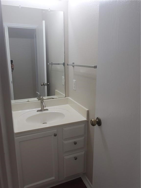 551 New Country Road Kyle, TX 78640 - Photo 19 of 34 a bathroom with a sink and a mirror