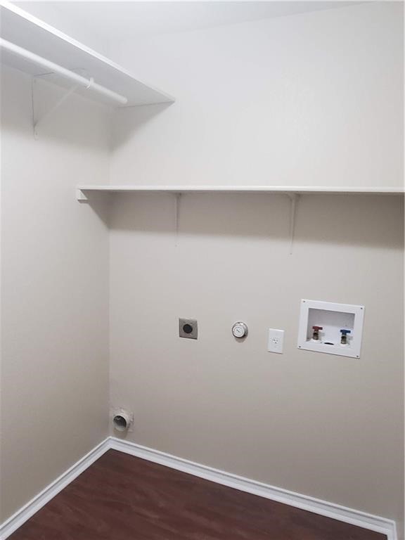 551 New Country Road Kyle, TX 78640 - Photo 27 of 34 a view of a room with wooden floor