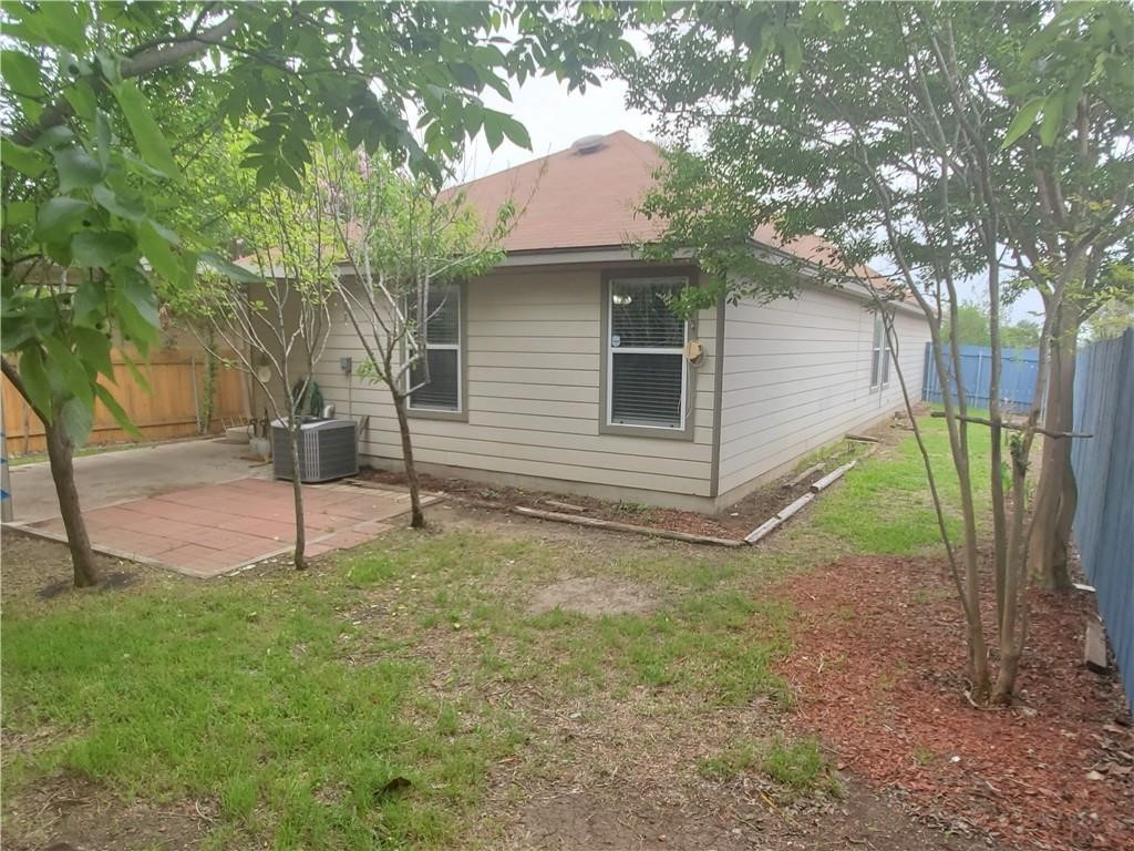551 New Country Road Kyle, TX 78640 - Photo 31 of 34 a house that has a tree in front of the house