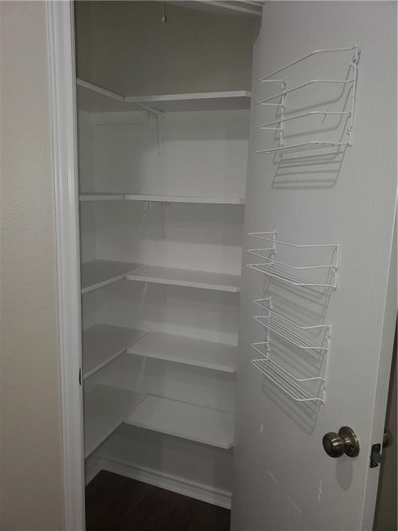 551 New Country Road Kyle, TX 78640 - Photo 7 of 34 a view of walk in closet with empty racks