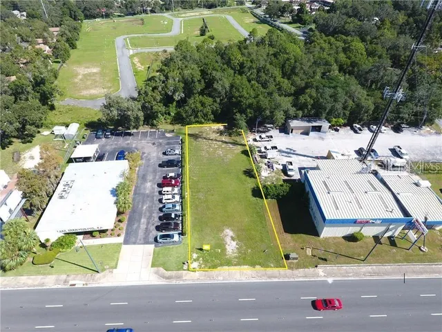 an aerial view of residential house with outdoor space and swimming pool