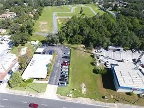 an aerial view of a house with a swimming pool
